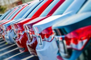 learn why dealerships are charging crazy car prices